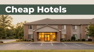 A roadside hotel in Clanton with tidy parking and greenery at golden hour.