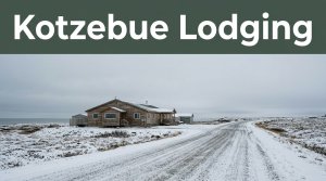 A small Kotzebue hotel beside a snowy road under a gray Arctic sky.