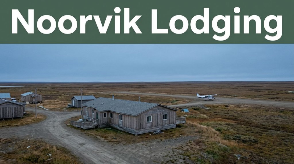 A Noorvik lodging house beside tundra, low buildings, and a distant bush plane.