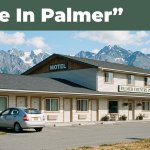 A roadside motel, rental car, mountains, and a green Save In Palmer banner.