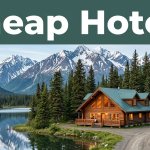 A cozy lodge beside an Alaskan lake with spruce trees and snow-capped mountains.