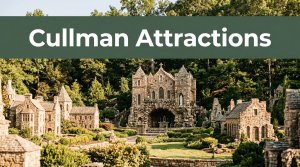Ave Maria Grotto miniature buildings beneath a Cullman Attractions banner.