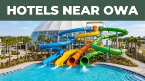 Colorful water slides and a splash pool appear beneath a Hotels Near OWA banner.