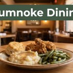 Southern comfort food on a wooden table with a green Humnoke Dining banner.