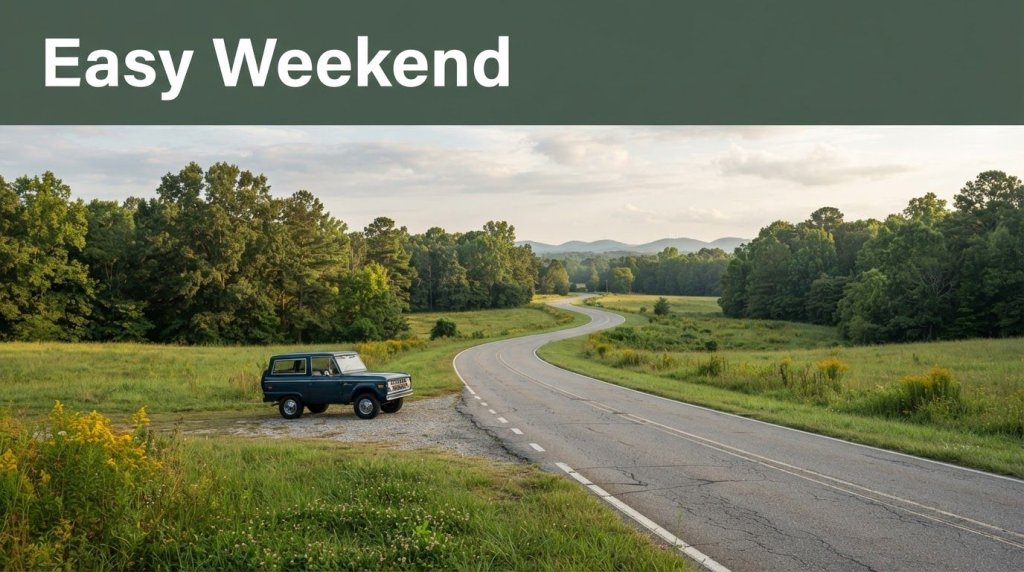 A country road through an Alabama meadow with a parked car and green Easy Weekend banner.
