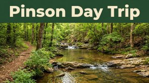 A rocky creek and forest trail beneath a green Pinson Day Trip banner.