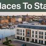 A boutique hotel overlooks Ipswich marina beneath a green Places To Stay banner.