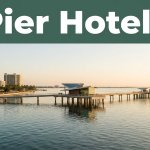 The modern St. Pete Pier extends into calm Tampa Bay beside downtown waterfront buildings.