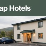 A budget hotel entrance near Lawrence with a parked car and green headline banner.
