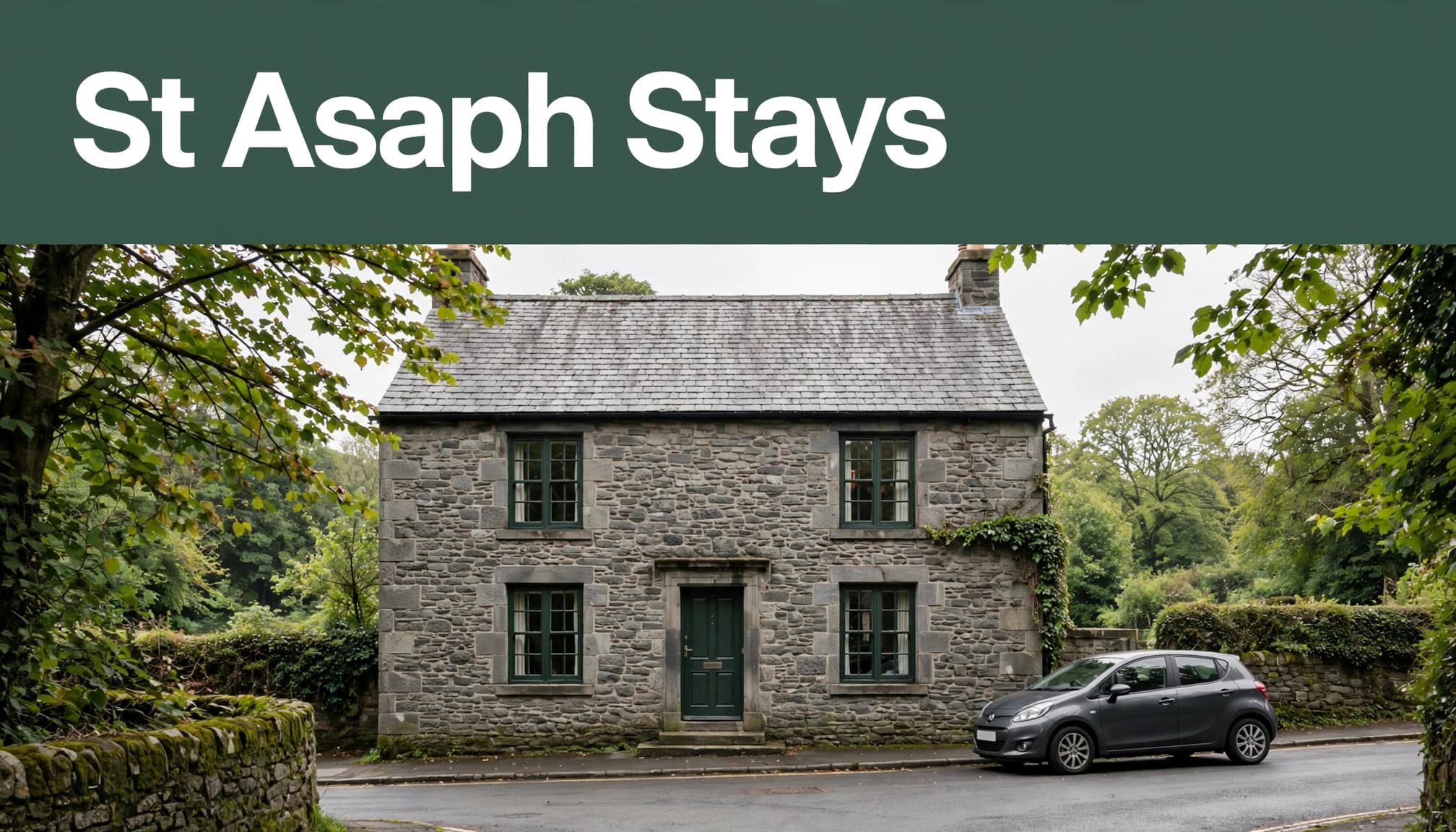 A historic stone hotel with a parked car on a leafy St Asaph street.